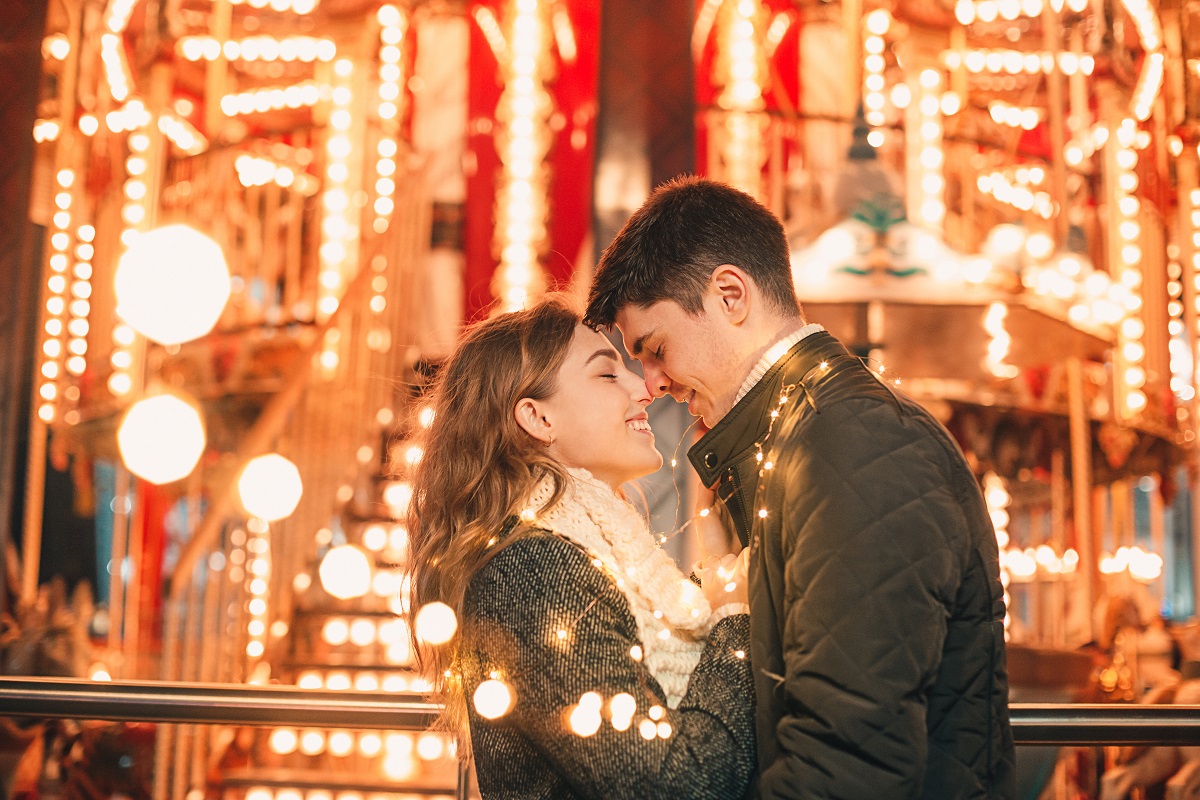 couple being romantic at a carnival